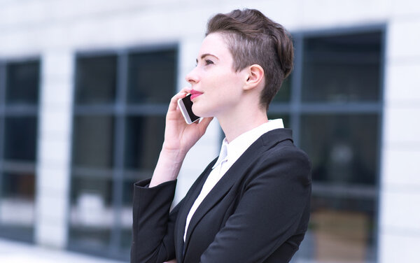 Modern business woman talking on phone