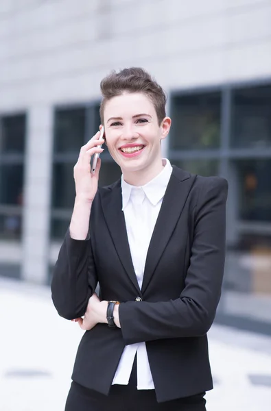 Modern business woman talking on phone — Stock Photo, Image