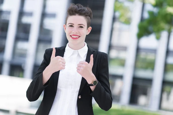 Modern business woman thumb up