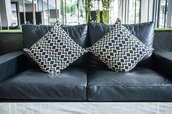 Sofa and pillows in room — Stock Photo, Image