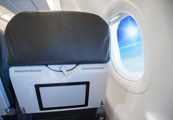 Image of fasten seat belt while seated sign on airplane. — Stock Photo, Image