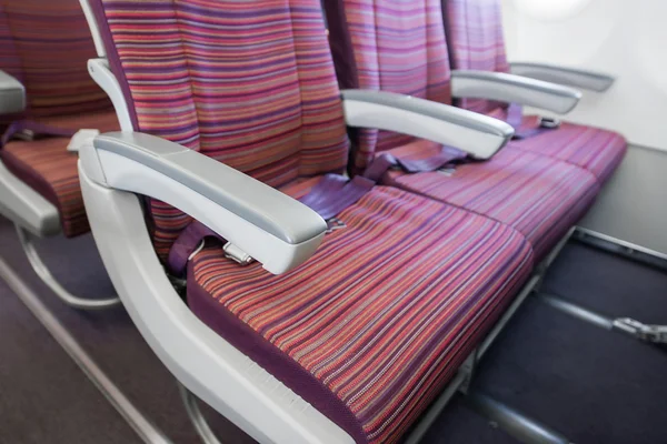 Armchair and Empty airplane seats — Stock Photo, Image