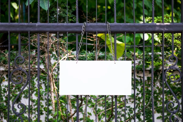 Sign on  metallic fence — Stock Photo, Image