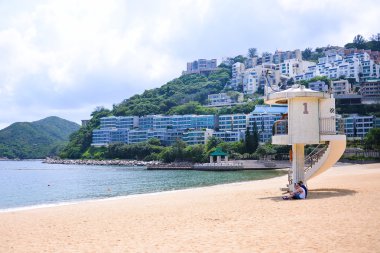 HONG KONG - JUN 12, Repulse Bay, is a bay in the southern part of Hong Kong Island and nearly Kwun Yim Shrine is a Taoist shrine at the southeastern end of Repulse Bay on June 12, 2015. clipart