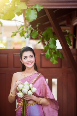 Beautiful Thai girl in Thai traditional costume clipart