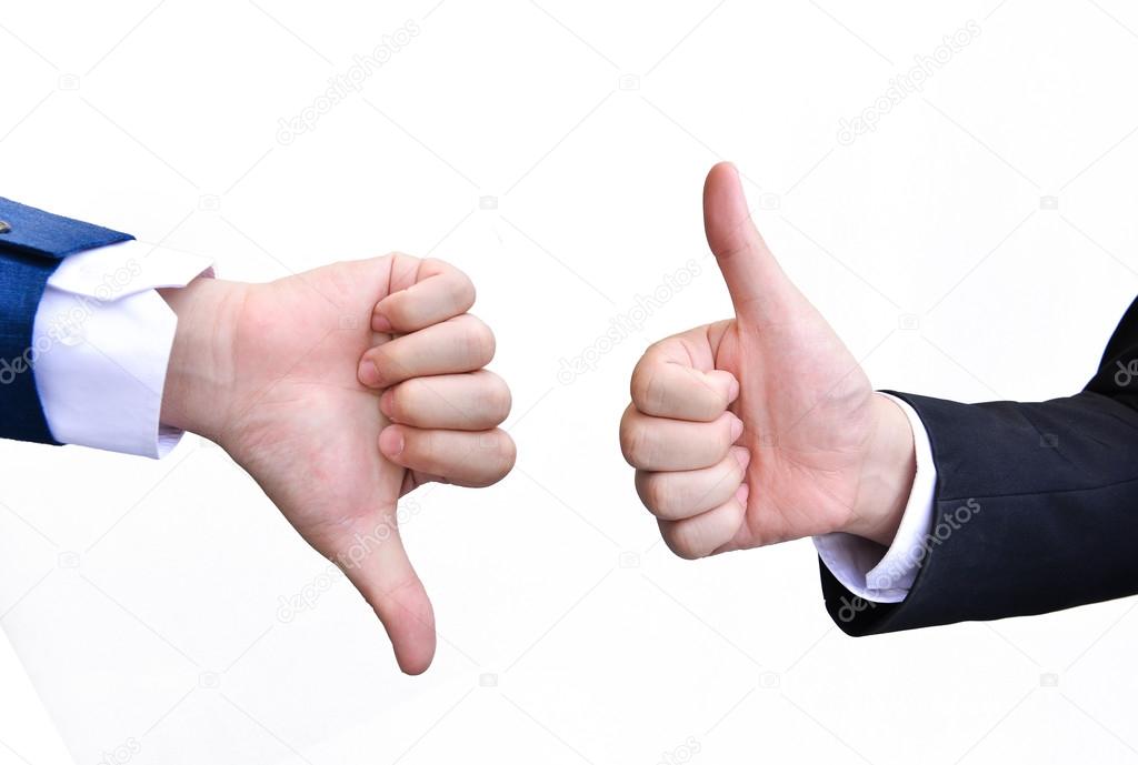 Two hands signalling thumbs up and thumbs down
