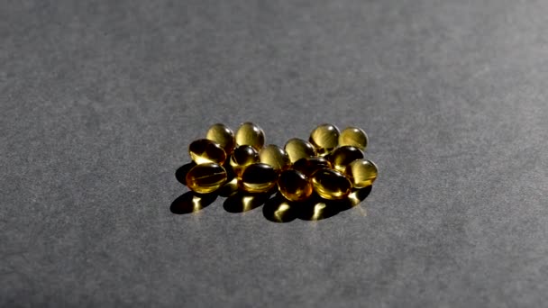 Vitamin D capsules. black background. Biologically active additives — Stock Video