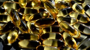 Omega 3 altın balık yağı kapsülleri, dönüş arkaplanı, makro