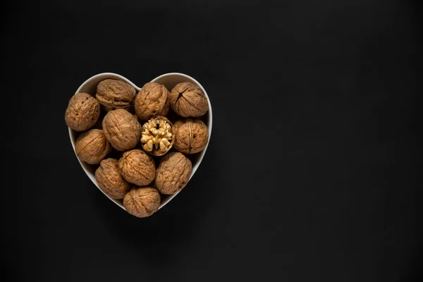 Whole Walnuts One Cracked Broken Heart White Heart Shaped Bowl — Stock Photo, Image
