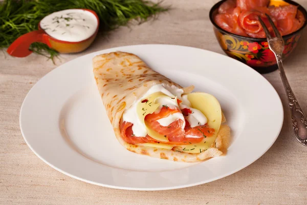 Food pancake with salmon cheese on a plate still life — Stock Photo, Image