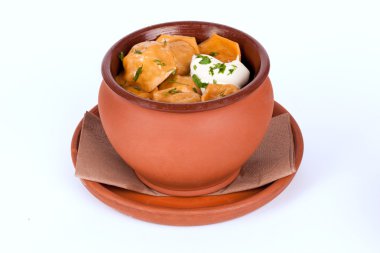 dumplings with greens and sour cream pot isolated white background for the menu