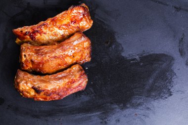 baked ribs isolated on black background barbecue grill