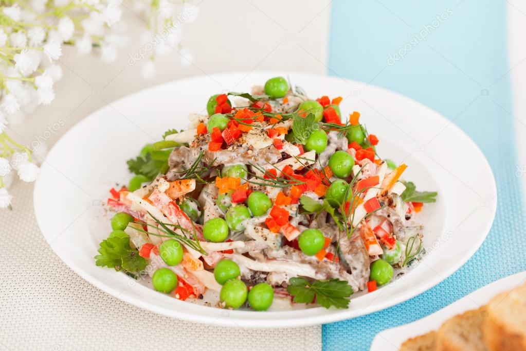 meat salad with fresh green peas 
