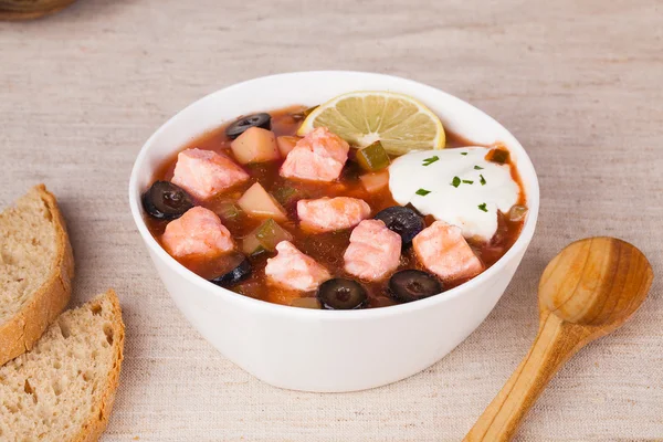 Fish thistle soup with meat sour cream and lemon in a still life — Stock Image Fish thistle soup with meat sour cream and lemon in a still life Royalty Free Stock Images