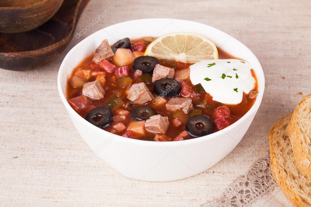 thistle soup with meat sour cream and lemon in a still life 