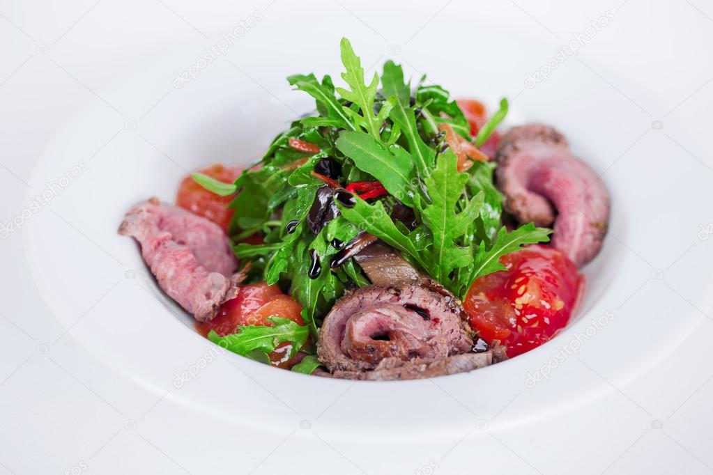 food salad with smoked meat arugula and balsamic sauce 