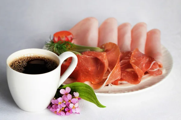 coffee cups and plates with threaded ham