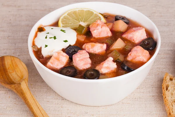 Fish thistle soup with meat sour cream and lemon in a still life — Stock Image Fish thistle soup with meat sour cream and lemon in a still life Royalty Free Stock Photos