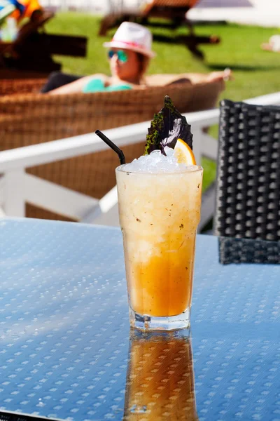 Citrus cocktail with ice, lemon and basil — Stock Photo, Image