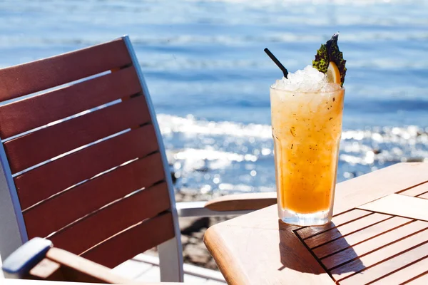 Citrus cocktail with ice, lemon and basil — Stock Photo, Image