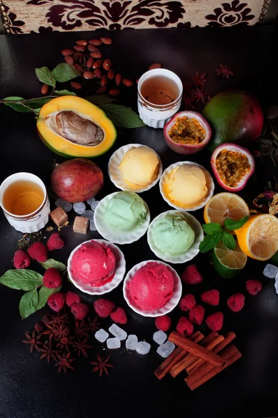 still life different types ice cream pink yellow white, raspberry, mango, passion fruit, spice, cinnamon, star anise, beautiful, appetizing