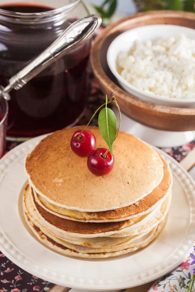 Pancakes with cherry flowers still life summer — Stock Photo, Image