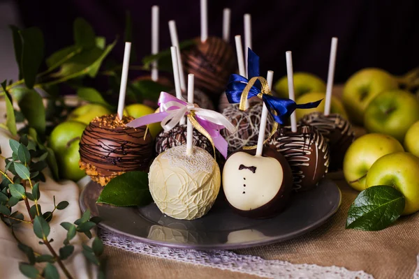 Apples on a stick in the wedding day — Stock Photo, Image