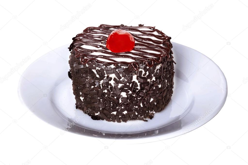chocolate cake with cherries on a plate
