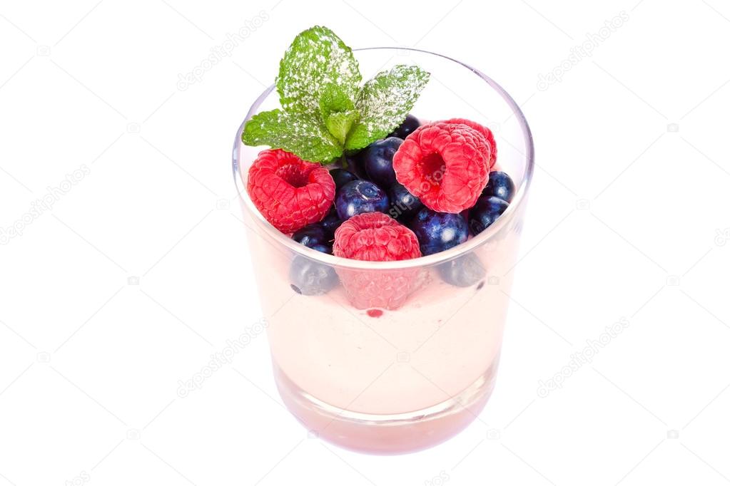 dessert in a glass with berries and mint