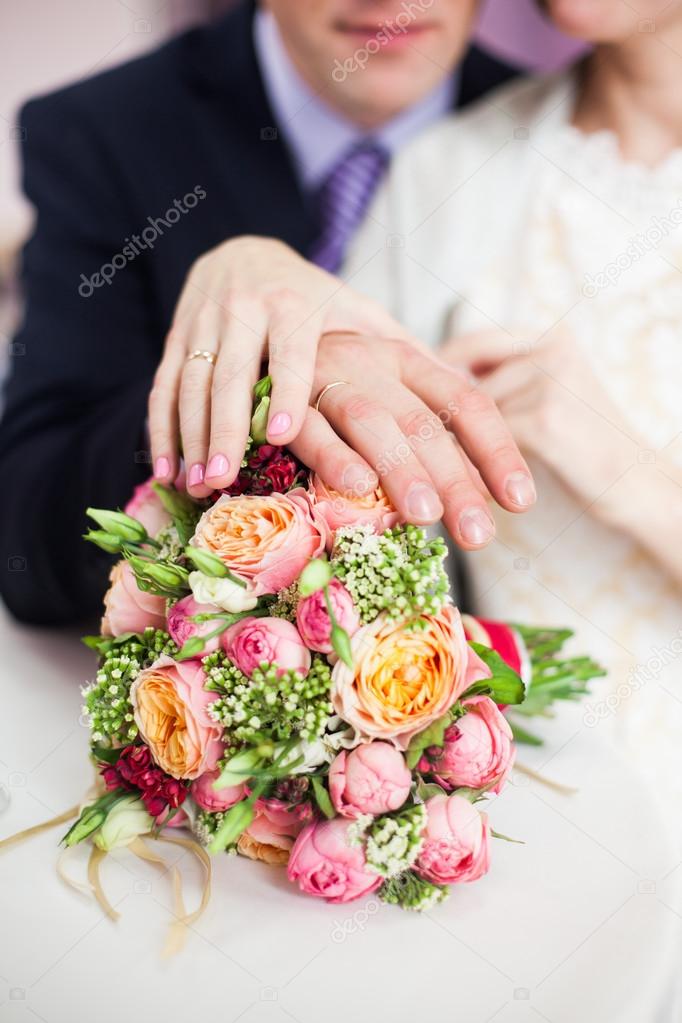 bridal bouquet of roses, buttercups and other flowers