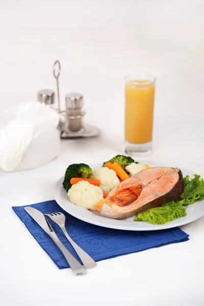 salmon steak with steamed vegetables