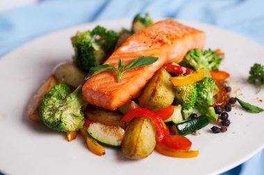 salmon fillet with vegetables and basil clipart