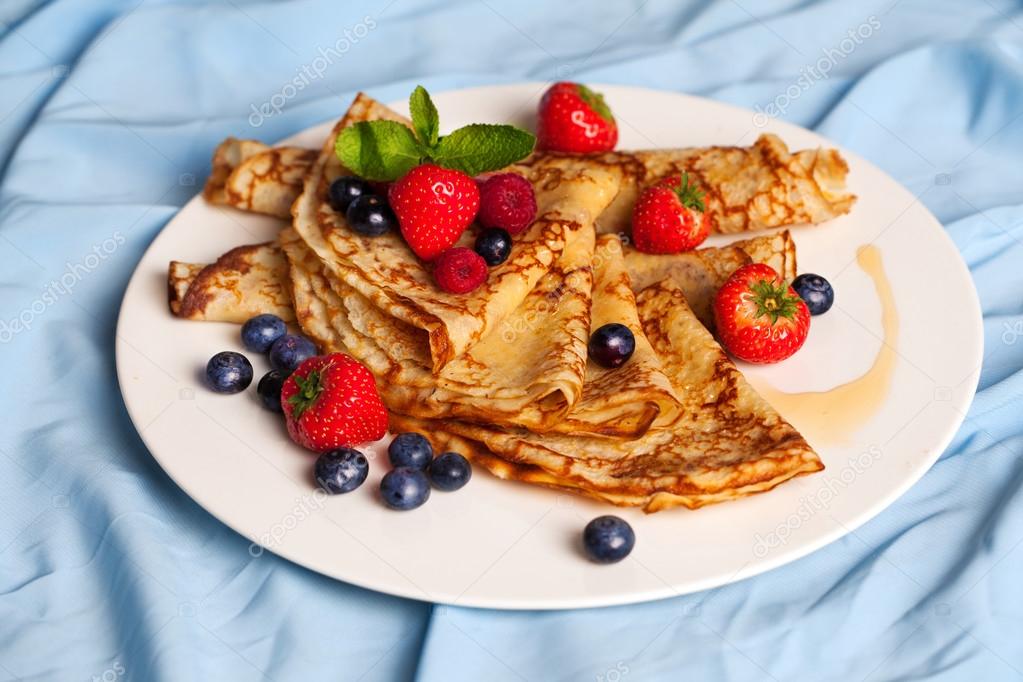 pancakes with mint, strawberries, raspberries, blueberries