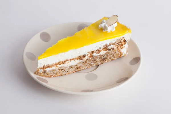 Lemon cake with almonds on a saucer — Stock Photo, Image