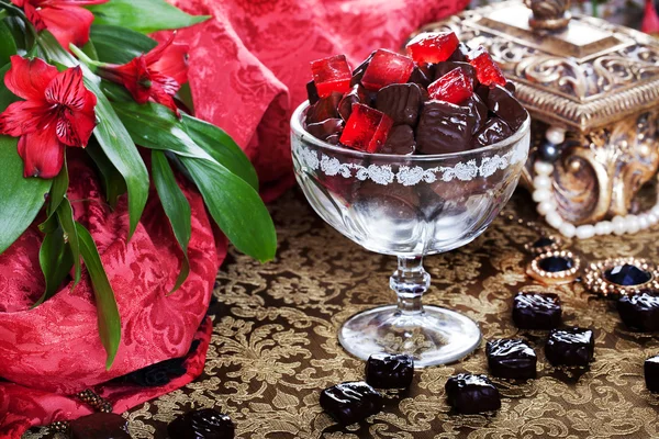 Luxury chocolates in a still life with gold casket — Stock Photo, Image