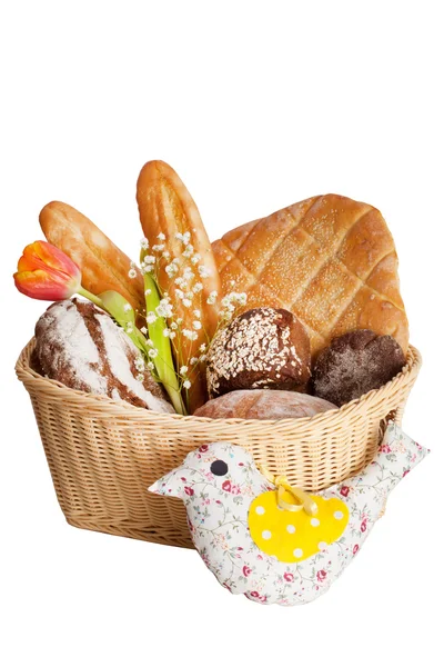 Basket with a baguette and buns in the style of Provence tulips — Stock Photo, Image