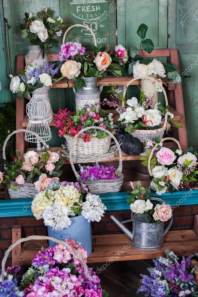 Flower shop, peonies, roses, artificial flowers Stock Photo by ©bratova
