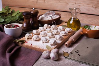 dumplings rural village board bay leaf still-life plank wood flour ingredients appetizing nourishing hand modeling
