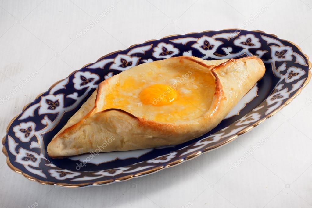 khachapuri meal oriental plate with egg isolated Uzbek dishes