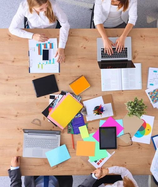 Business people sitting and discussing at business meeting, in office — Stock Photo, Image