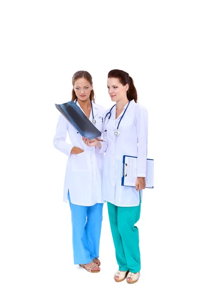 Two woman nurse watching X Ray image, standing in hospital — Stock Photo, Image