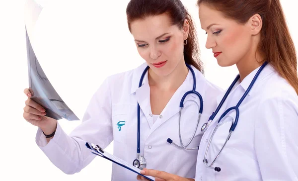 Two woman nurse watching X Ray image, standing in hospital — Stock Photo, Image