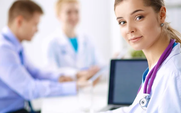 Medical team sitting at the table in modern hospital — Stock Photo, Image