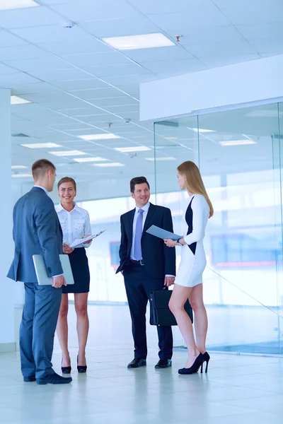 Smiling successful business team standing in office — Stock Photo, Image