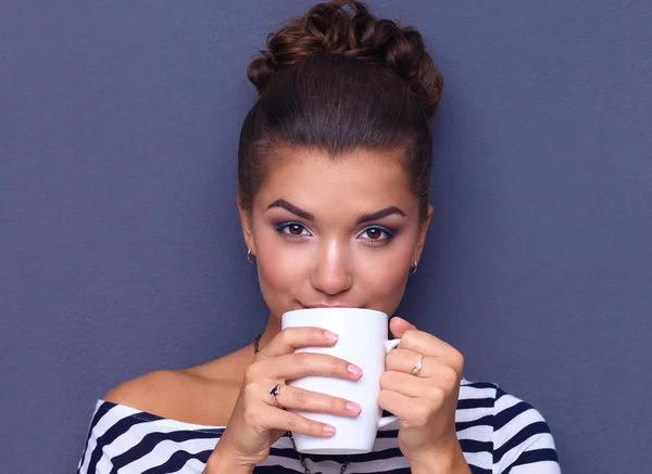 Portrait of  young woman with cup  tea or coffee — Stock Photo, Image