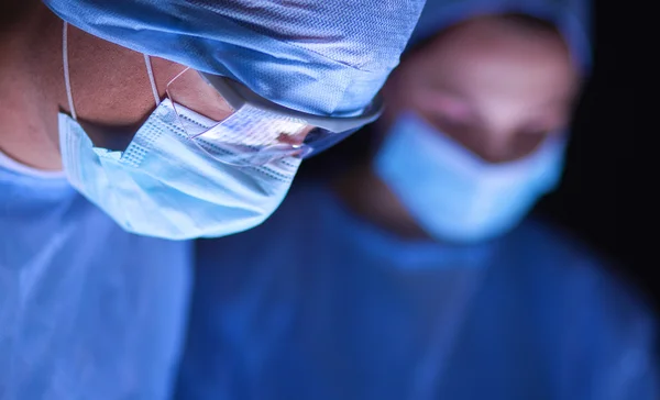 Team surgeon at work in operating room. — Stock Photo, Image