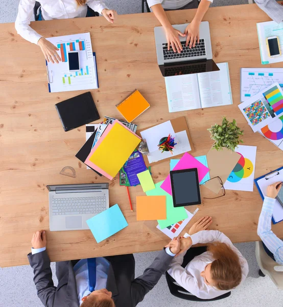 Business people sitting and discussing at business meeting, in office — Stock Photo, Image