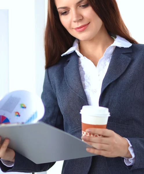 Beautiful  businesswoman enjoying coffee in bright office — Stock Photo, Image