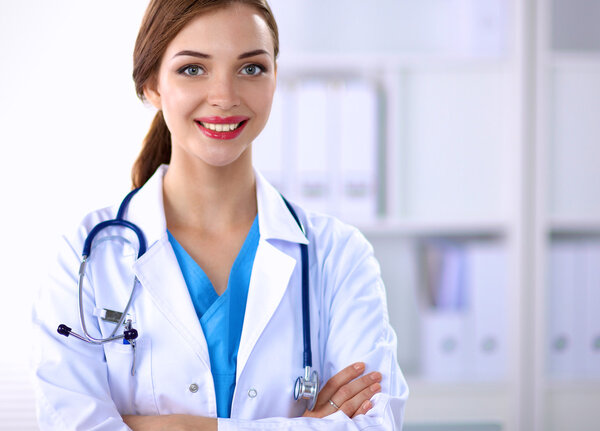 Medical team sitting at the table in modern hospital