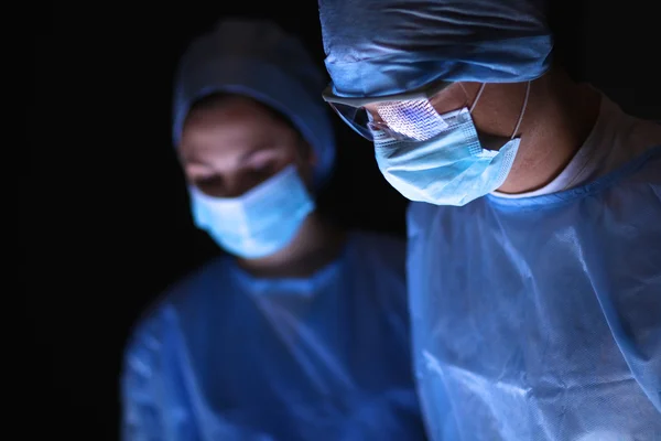 Team surgeon at work in operating room. — Stock Photo, Image